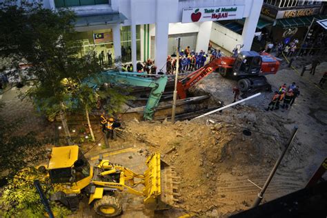Woman disappears down sinkhole in Malaysia's capital.